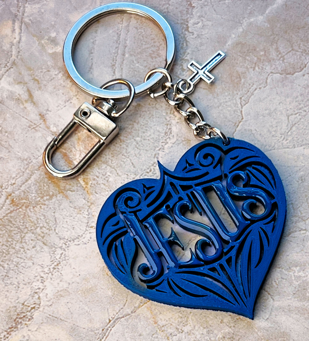 Blue heart-shaped keychain with 'Jesus' engraving 
